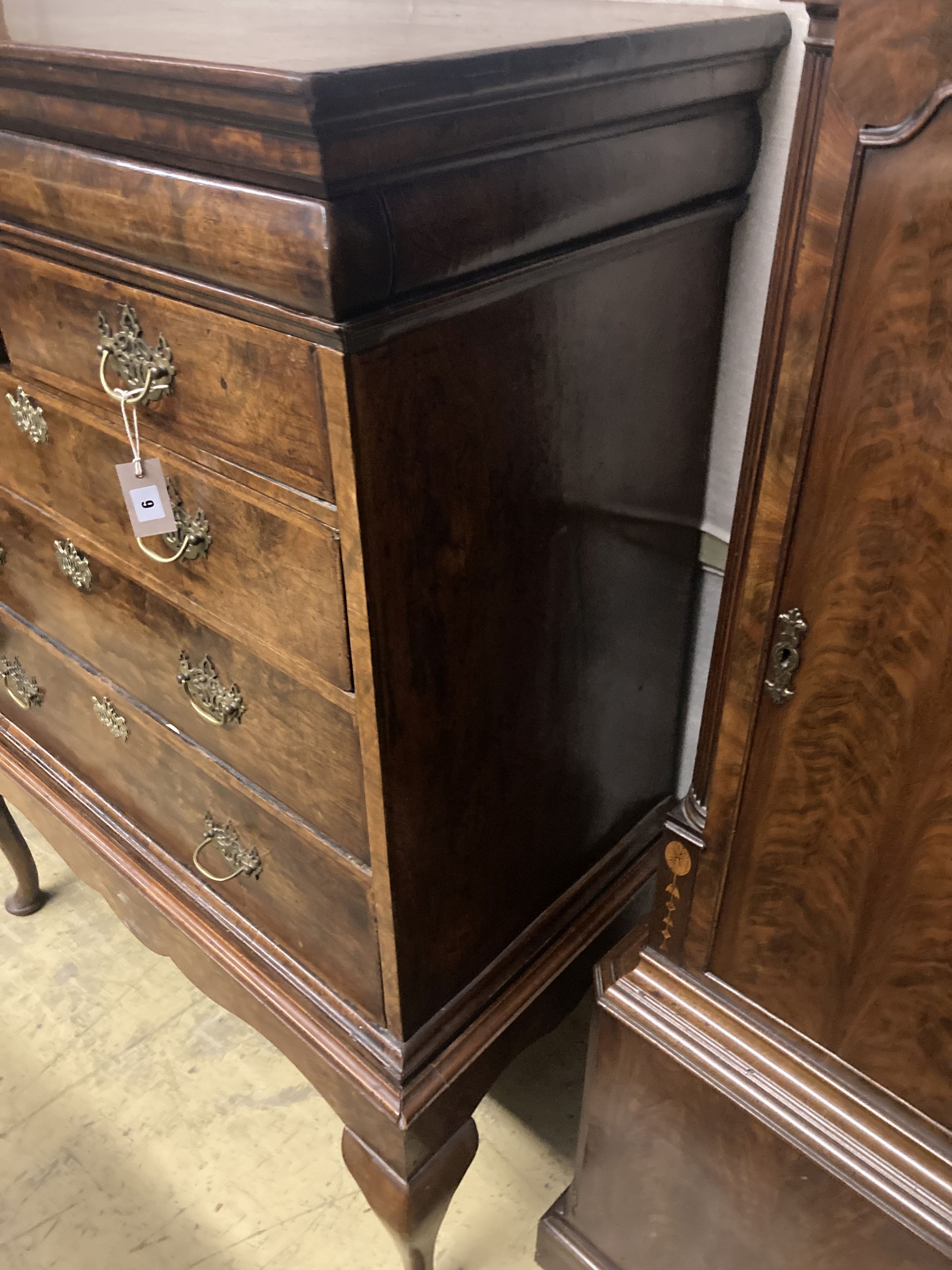 A mid 18th century walnut chest on stand, width 110cm depth 58cm height 142cm